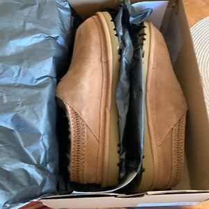 UGG New with tags in original box. M Neuman slip on size 8